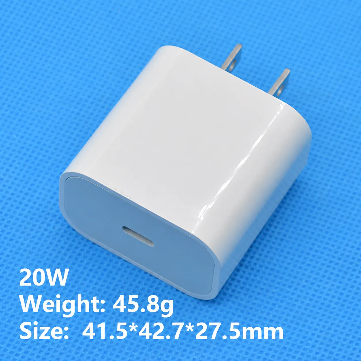 White 20W USB-C fast wall adapter with US plug pins and size and weight cues