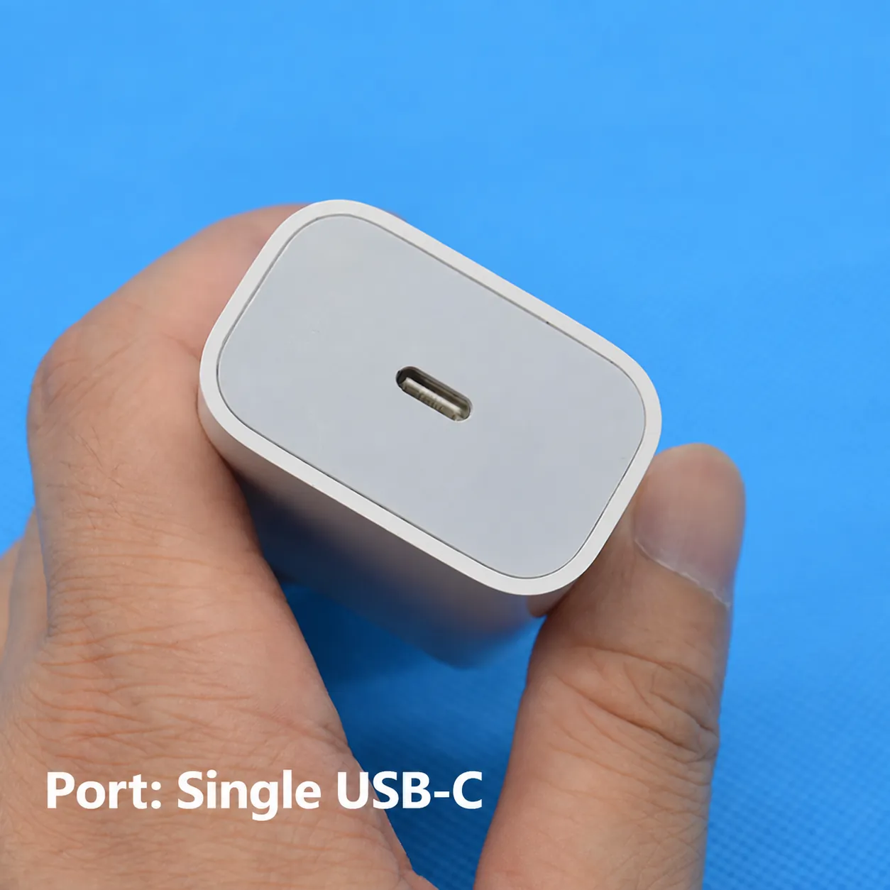 Close-up of single USB-C port on compact white 20W wall charger