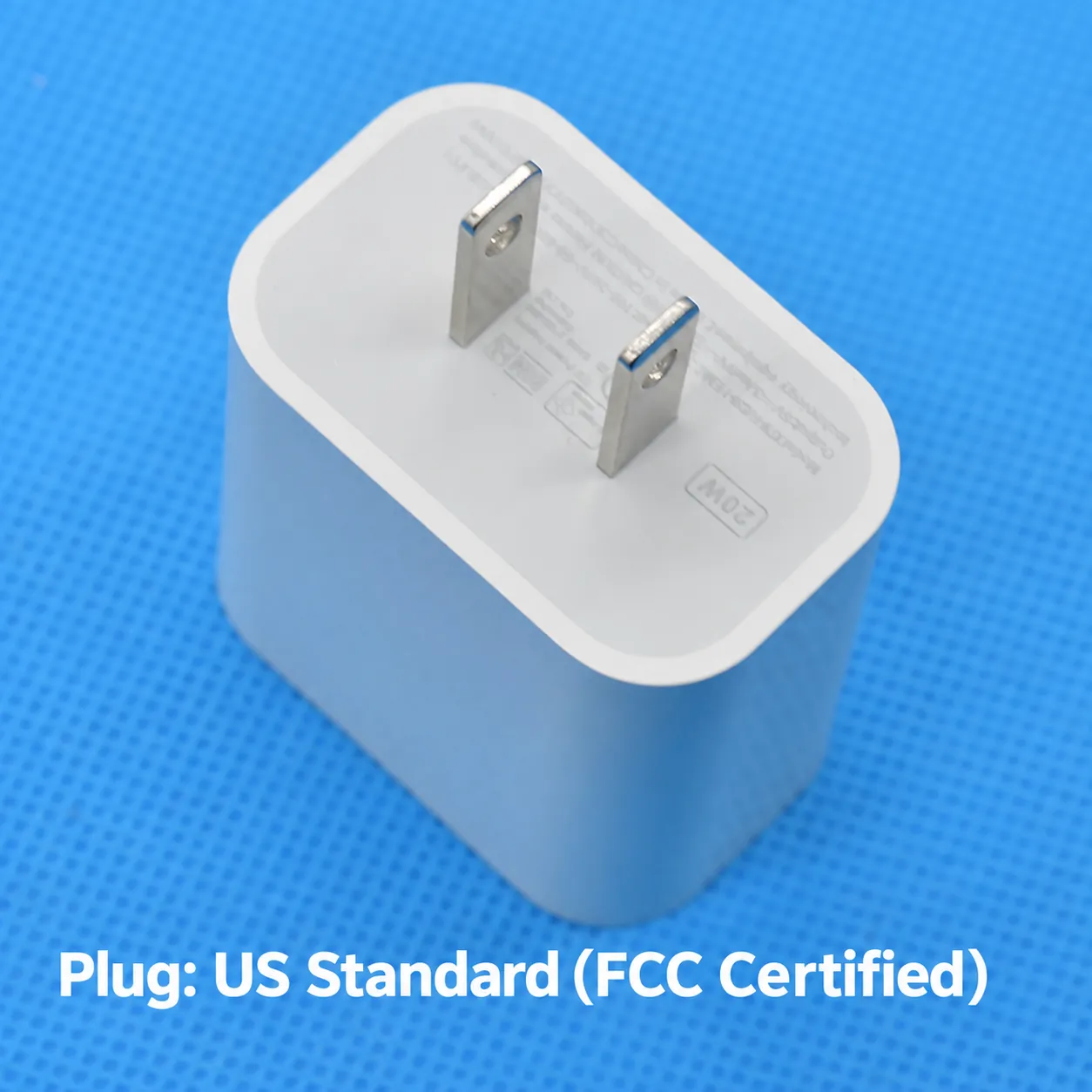 US standard plug view of white 20W USB-C charger with FCC certified cue