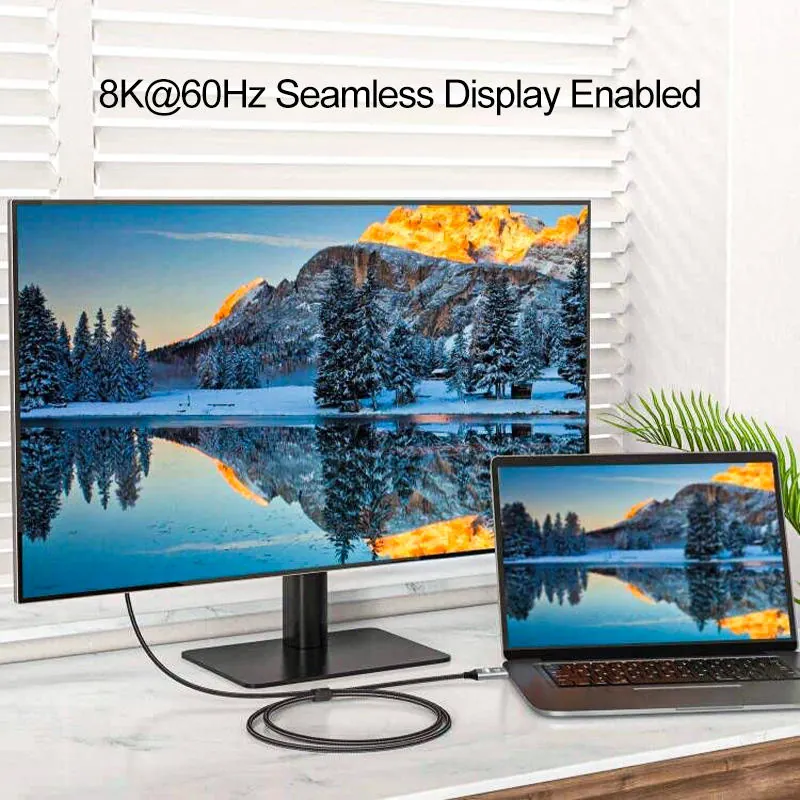 USB-C to DisplayPort cable connected from laptop to monitor with 8K 60Hz display cue